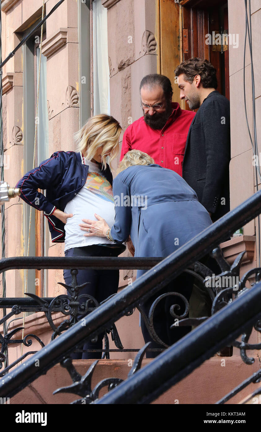 NEW YORK, NY - MARCH 22: Olivia Wilde, Mandy Patinkin and Oscar Isaac were on the set of the new movie 'Life Itself' on March 21, 2017 in New York City People: Olivia Wilde, Mandy Patinkin, Oscar Isaac Stock Photo
