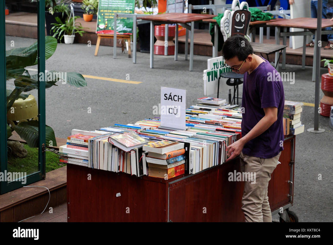 HO CHI MINH, VIET NAm, Reader reading book at bookstore, publishing company show colorful books