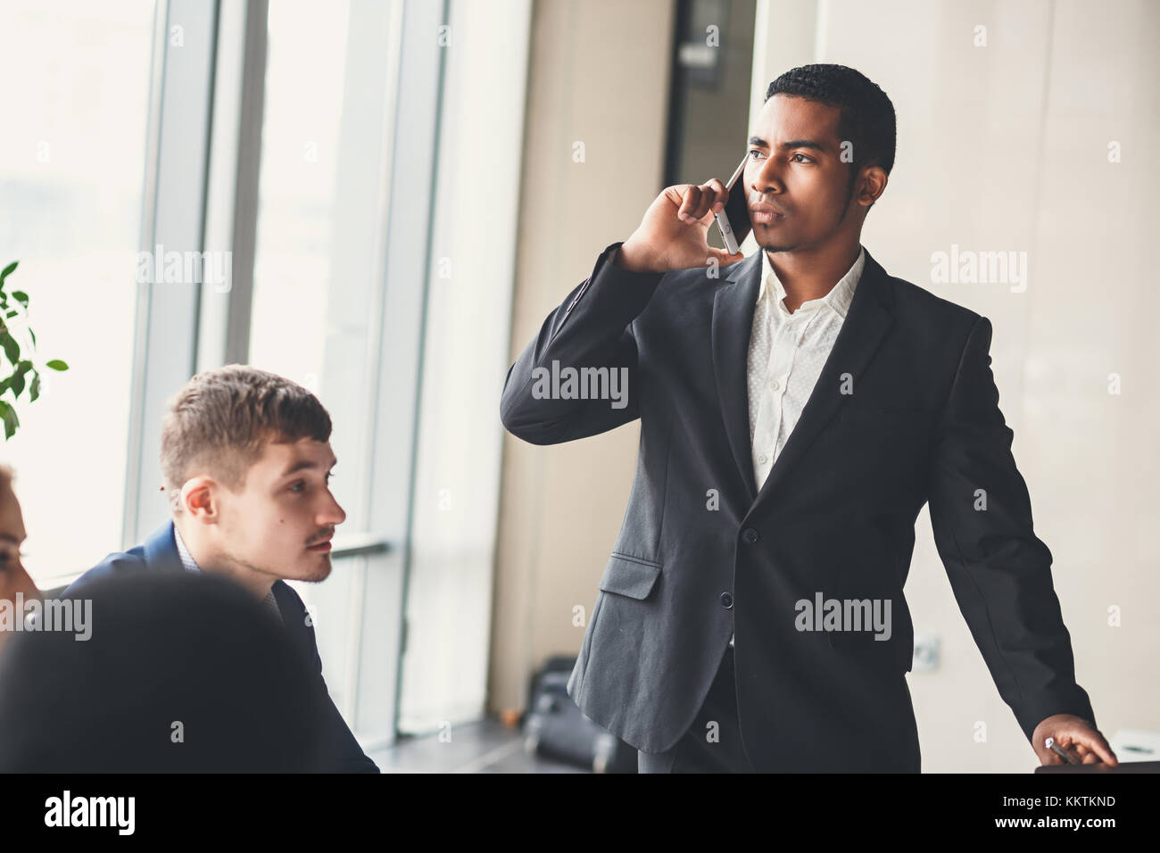 african american businessman using smart phone emailing or talking Stock Photo