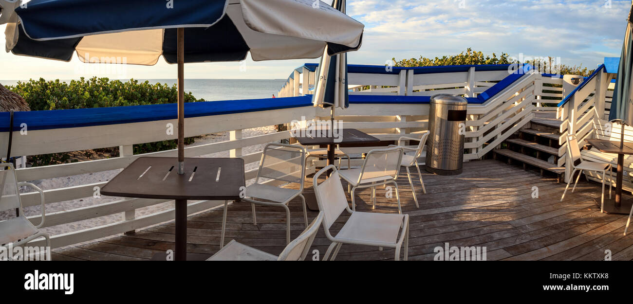 Tiki style tables and chairs on Clam Pass Beach in Naples, Florida, USA