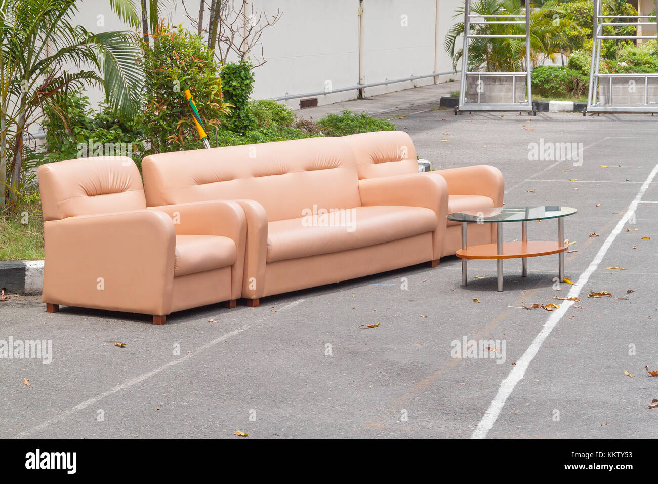 Leather sofa,Orange sofa placed outside in the launch business Stock Photo  - Alamy