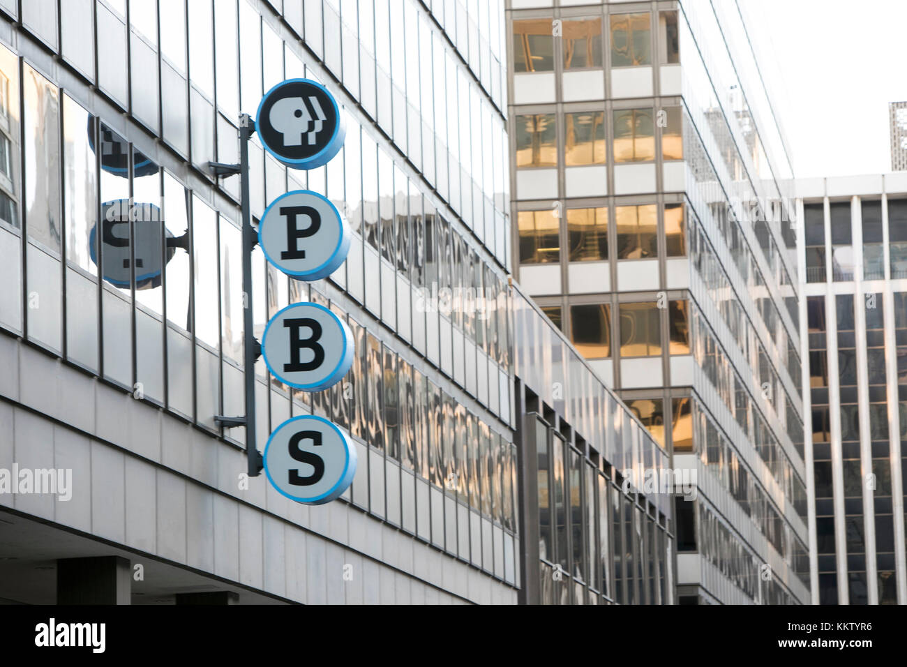 A logo sign outside of the headquarters of The Public Broadcasting Service (PBS) in Arlington