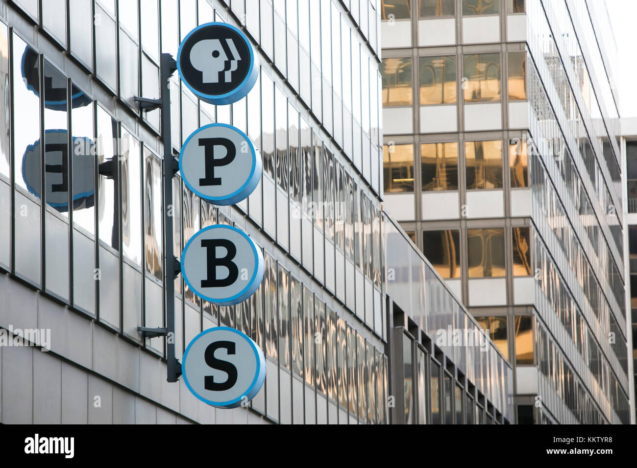 A logo sign outside of the headquarters of The Public Broadcasting
