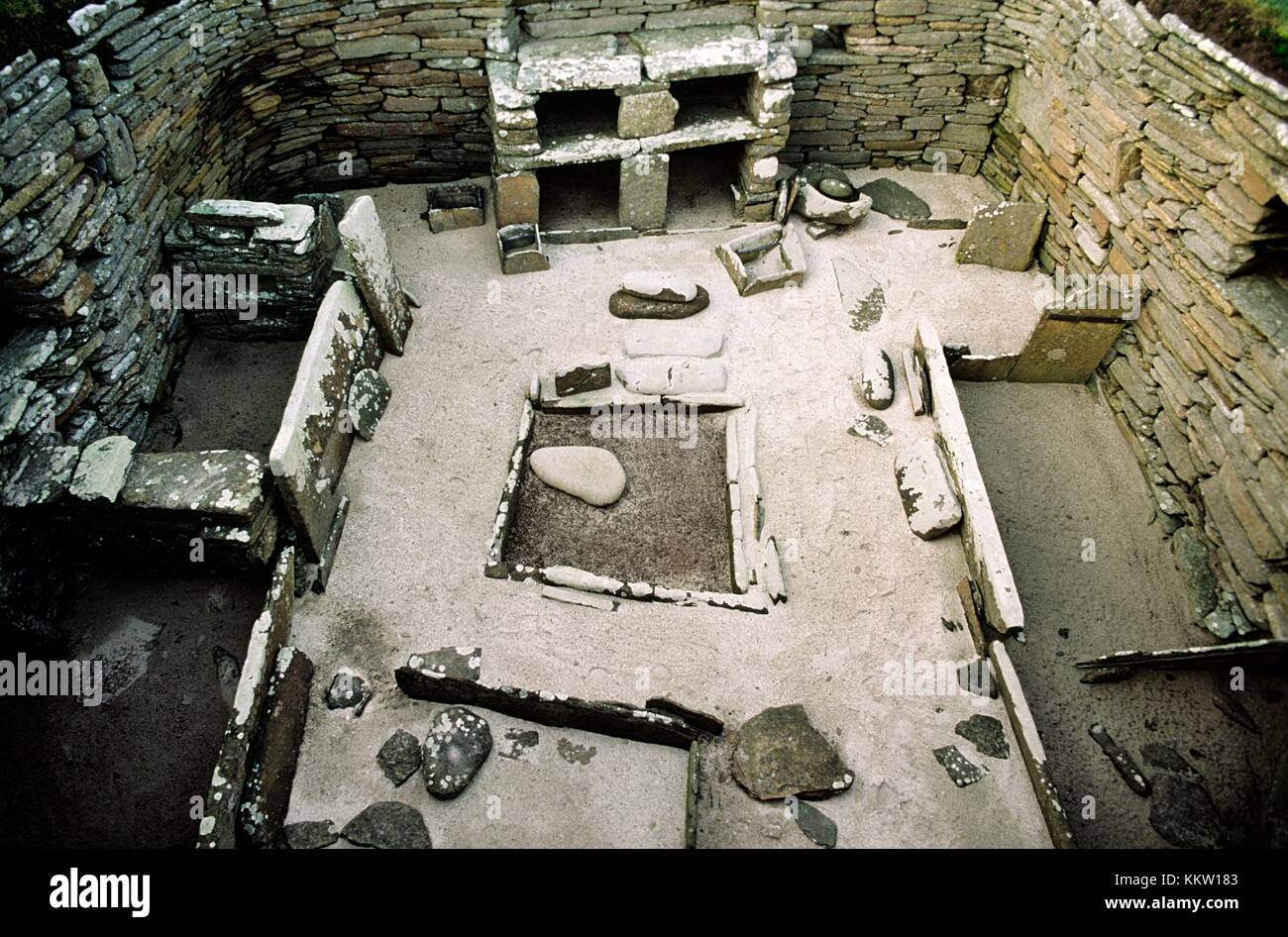 Skara Brae stone age village 3100 BC, Bay of Skaill, Mainland, Orkney, Scotland. House interior, box beds, hearth and cupboards Stock Photo