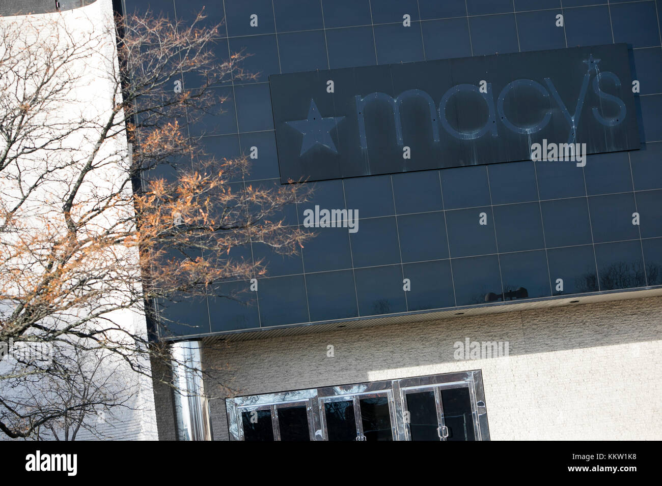 The outline of a Macy's logo sign outside of a now closed retail store