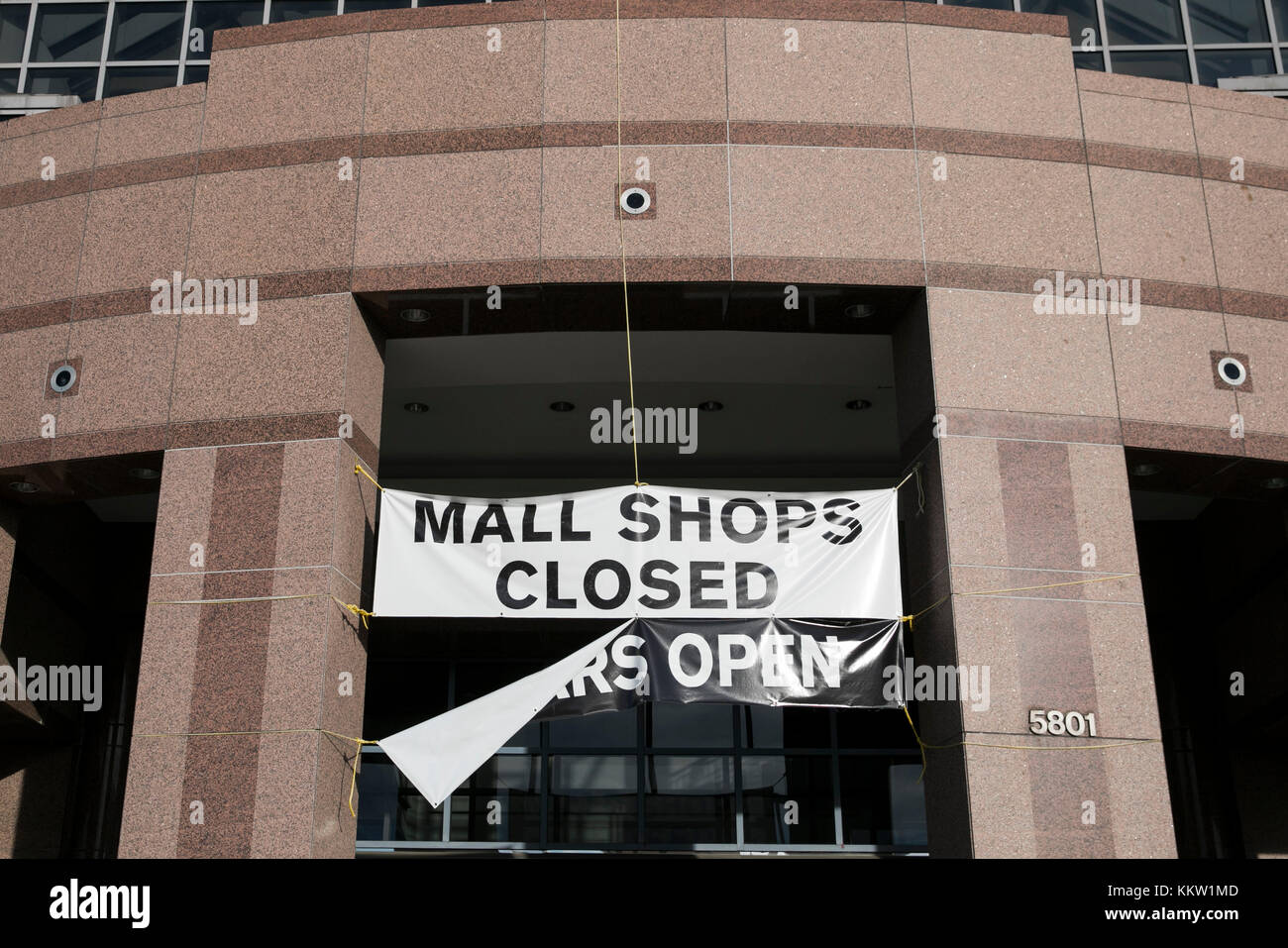 A banner that reads "Mall Shops Closed" outside of the now closed