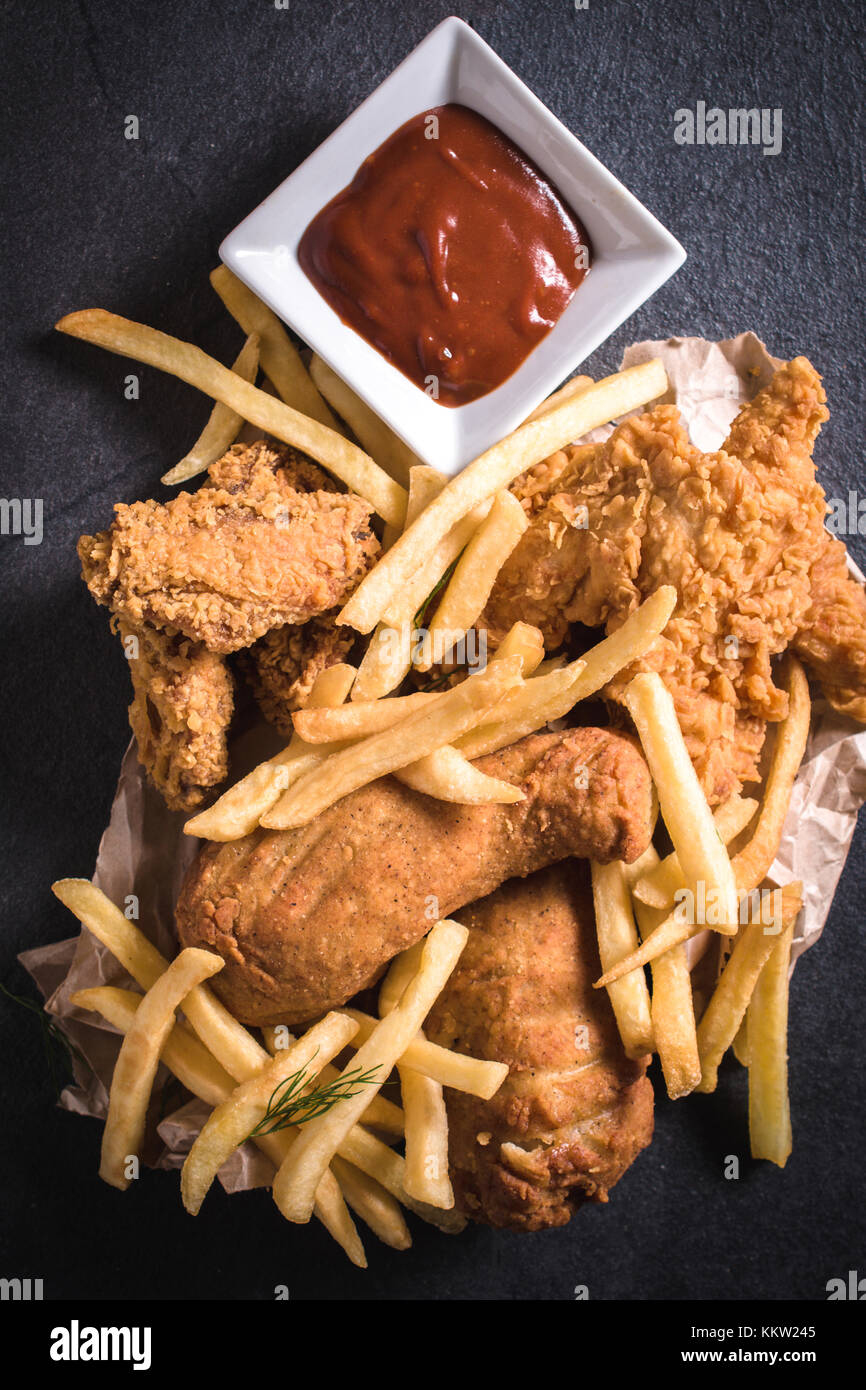Traditional American cuisine,fried chicken meat and French fries Stock