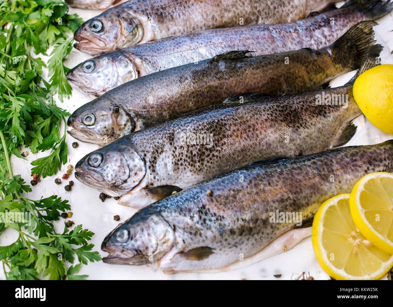 Thorough Fish Trout fish on the table waithing to be prepared Stock Photo - Alamy