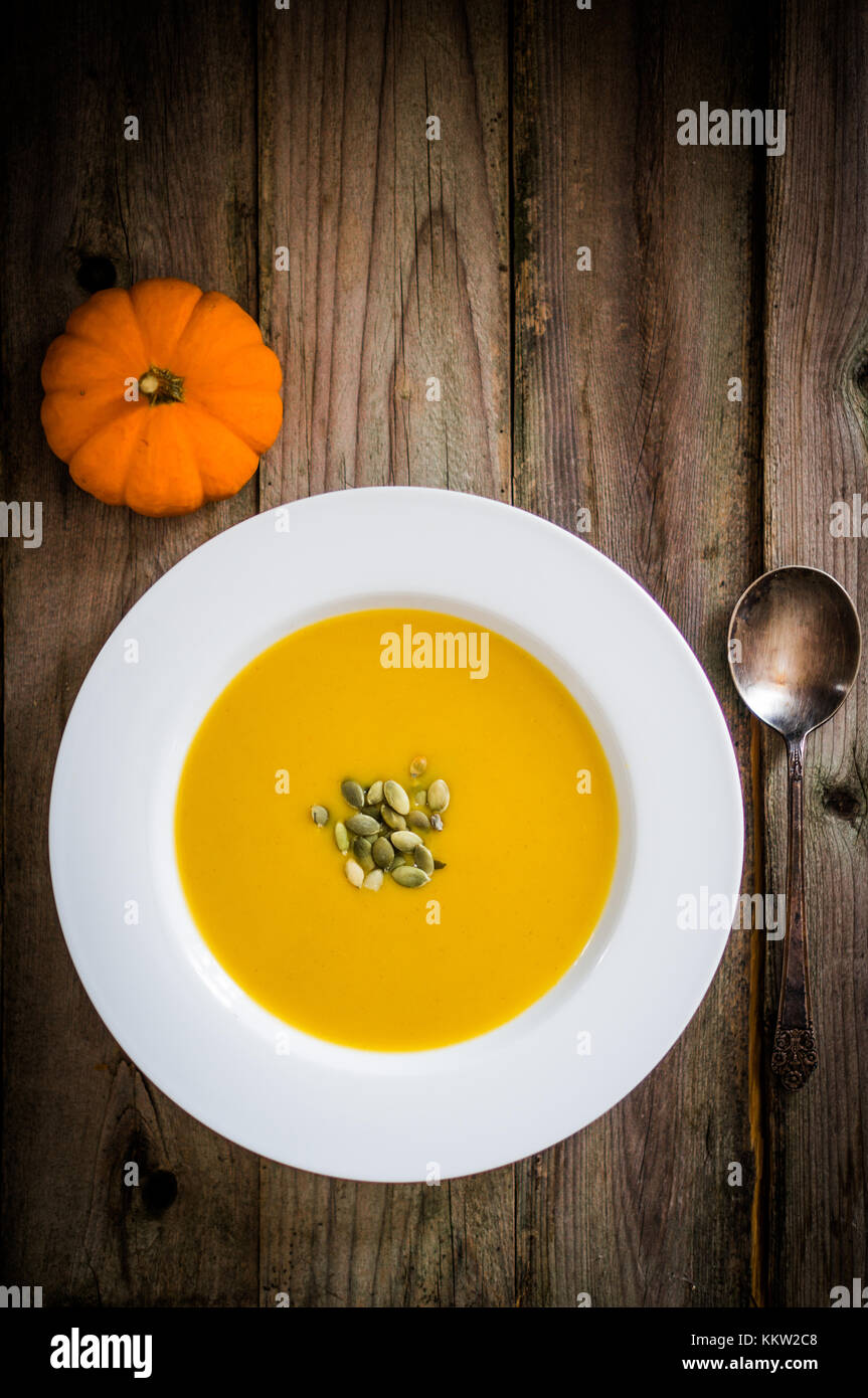 Pumpkin Soup On Wooden Background Stock Photo