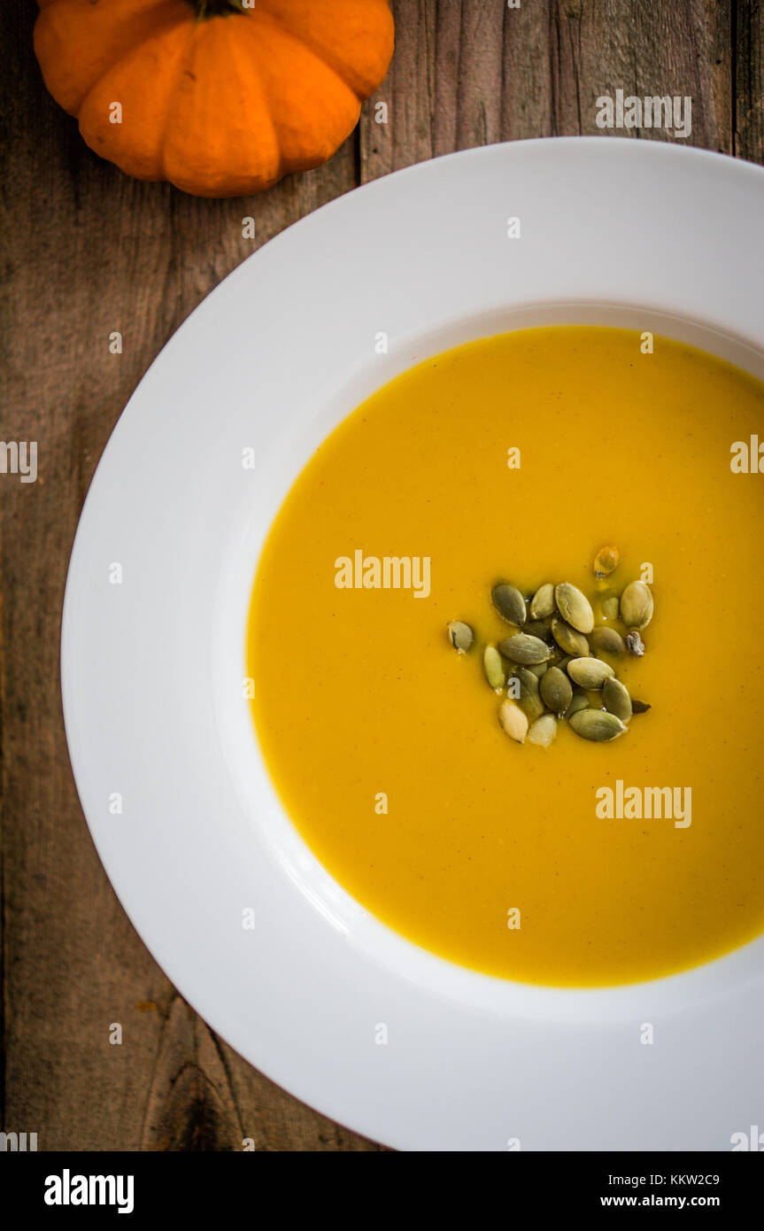 Pumpkin Soup On Wooden Background Stock Photo