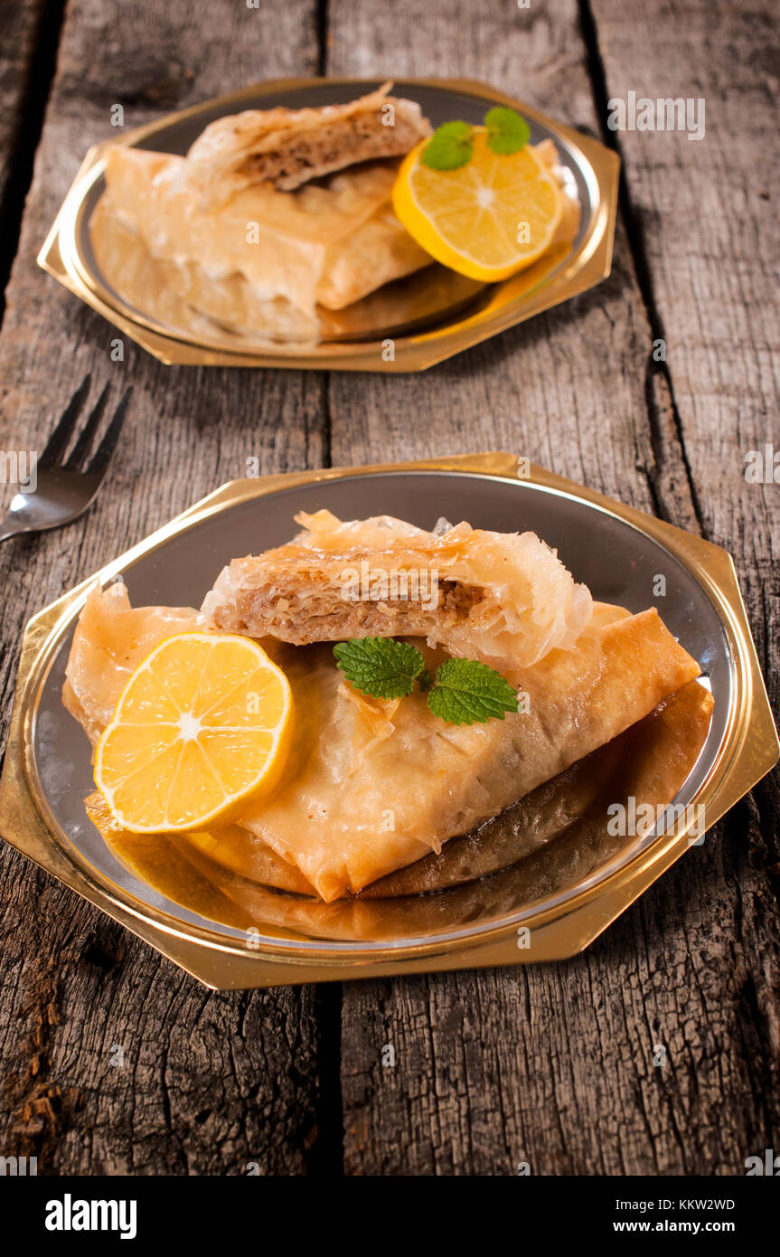 Sweet baklava dessert on the metal plates Stock Photo