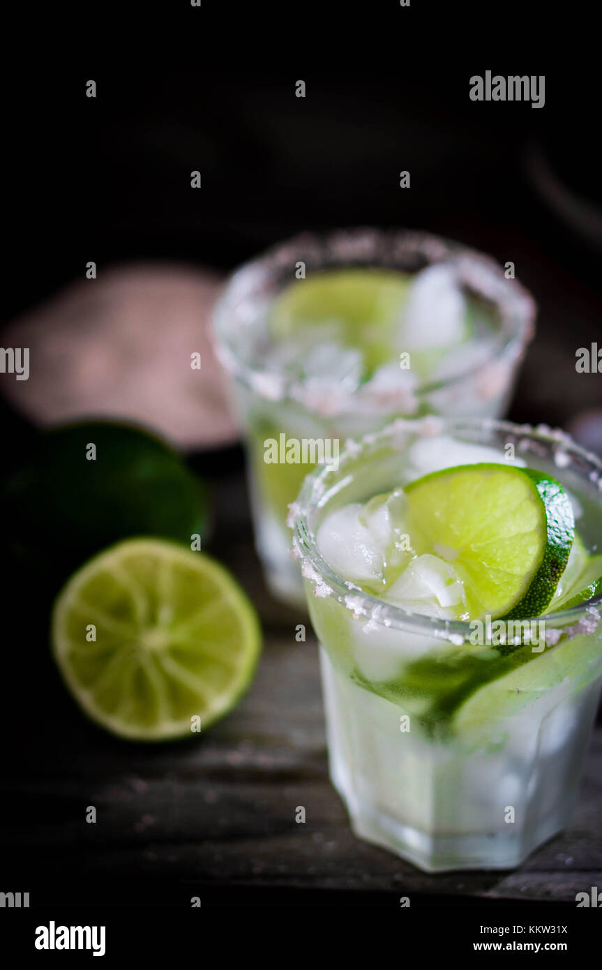 Water With Ice And Limes On Rustic Background Stock Photo