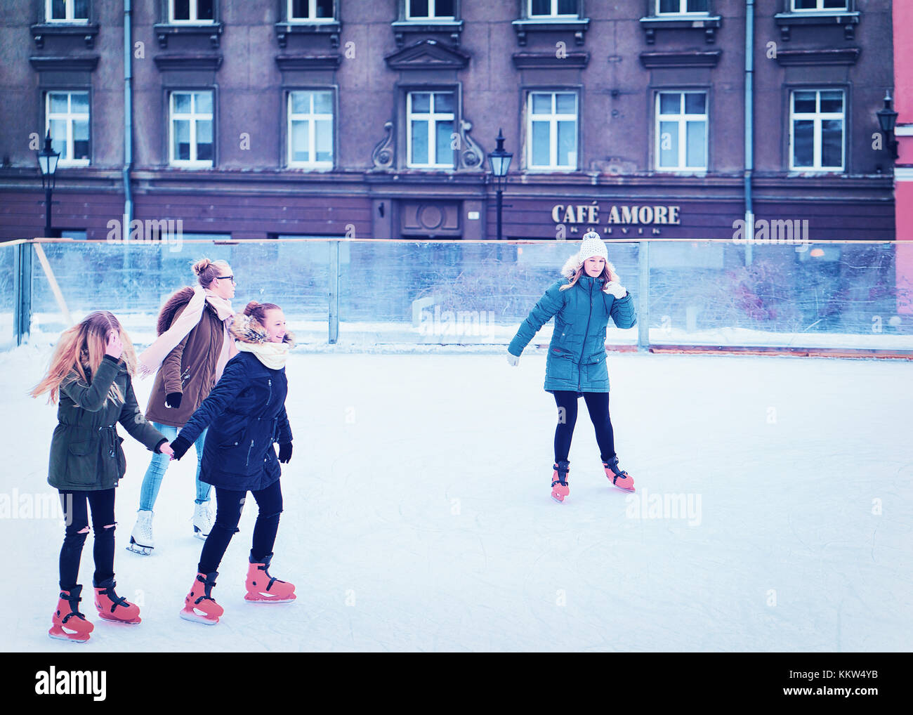 Tallinn, Estonia February 27, 2017 Group of female teenagers ice skating on the rink at the