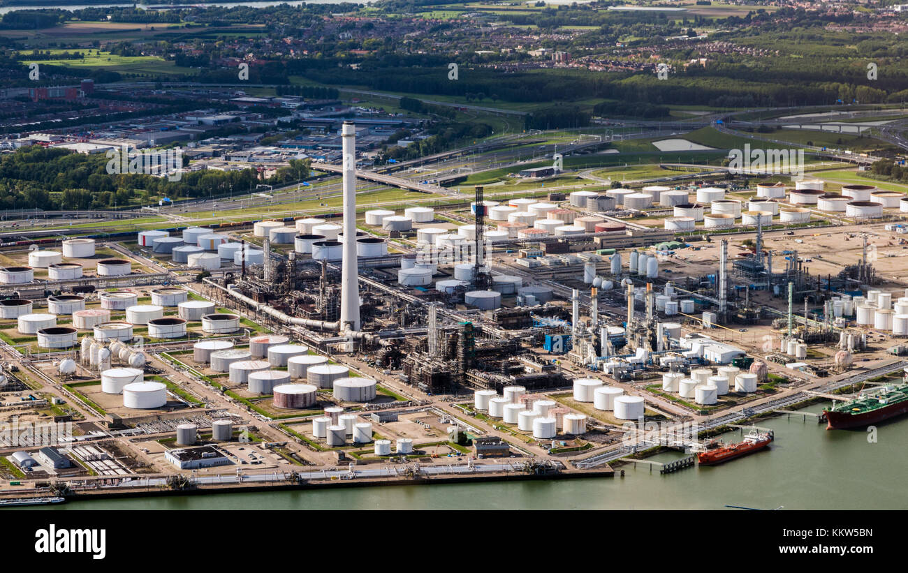 Aerial view of oil tankers moored at a oil storage terminal and oil refinery. Stock Photo