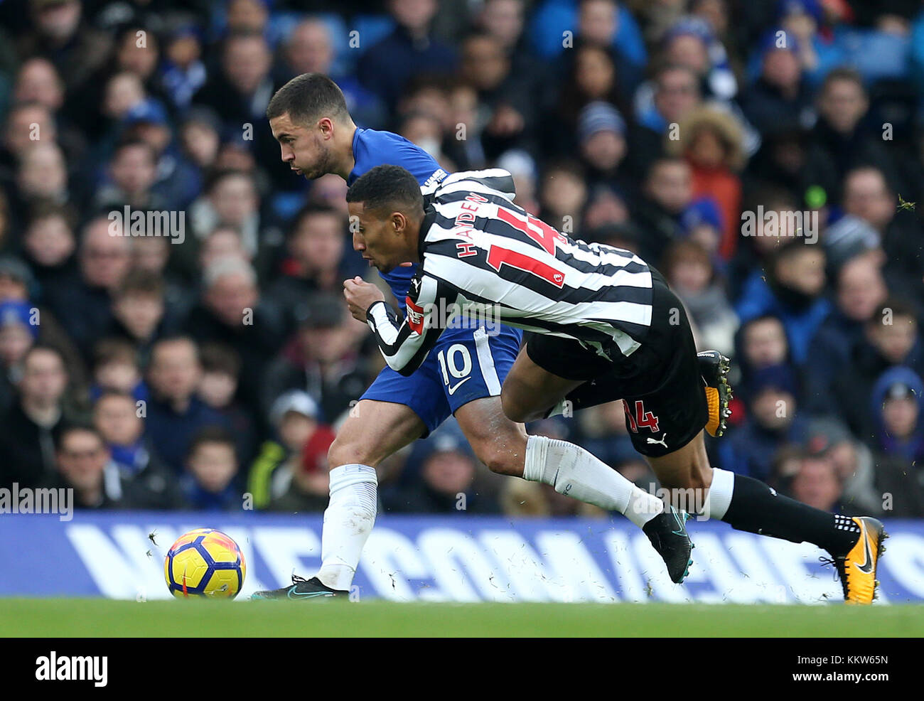Chelsea's Eden Hazard (left) and Newcastle United's Isaac Hayden battle for the ball during the Premier League match at Stamford Bridge, London. PRESS ASSOCIATION Photo Picture date: Saturday December 2, 2017. See PA story SOCCER London. Photo credit should read: Steven Paston/PA Wire. RESTRICTIONS: No use with unauthorised audio, video, data, fixture lists, club/league logos or 'live' services. Online in-match use limited to 75 images, no video emulation. No use in betting, games or single club/league/player publications. Stock Photo
