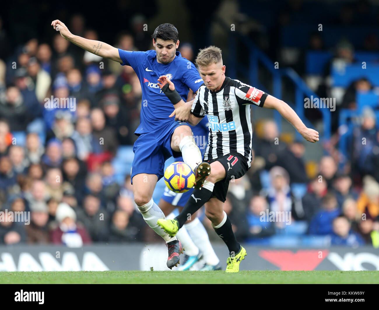 Newcastle United's Matt Ritchie (right) and Chelsea's Alvaro Morata battle for the ball during the Premier League match at Stamford Bridge, London. PRESS ASSOCIATION Photo Picture date: Saturday December 2, 2017. See PA story SOCCER London. Photo credit should read: Steven Paston/PA Wire. RESTRICTIONS: No use with unauthorised audio, video, data, fixture lists, club/league logos or 'live' services. Online in-match use limited to 75 images, no video emulation. No use in betting, games or single club/league/player publications. Stock Photo