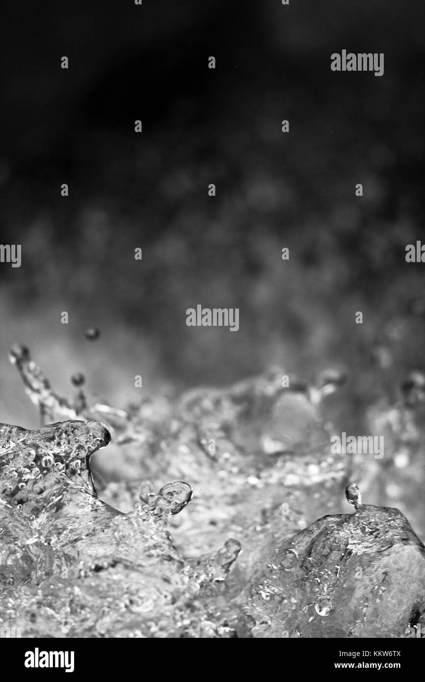 Splashes of water of a river photographed frontally. Stock Photo
