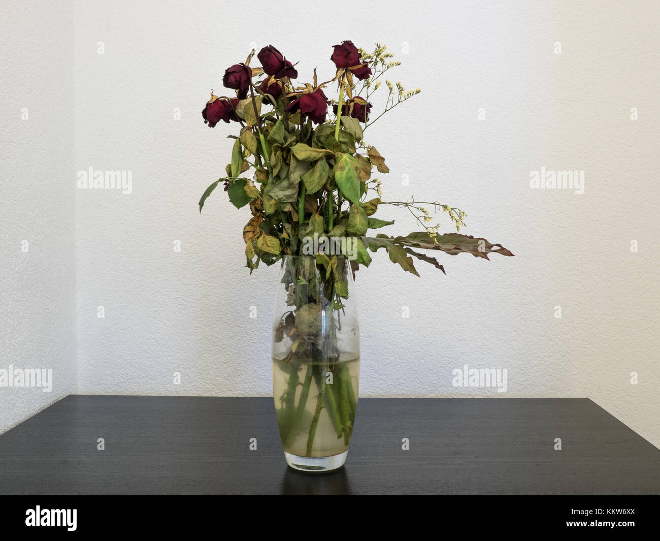 withered bunch of flowers in a glass vase Stock Photo