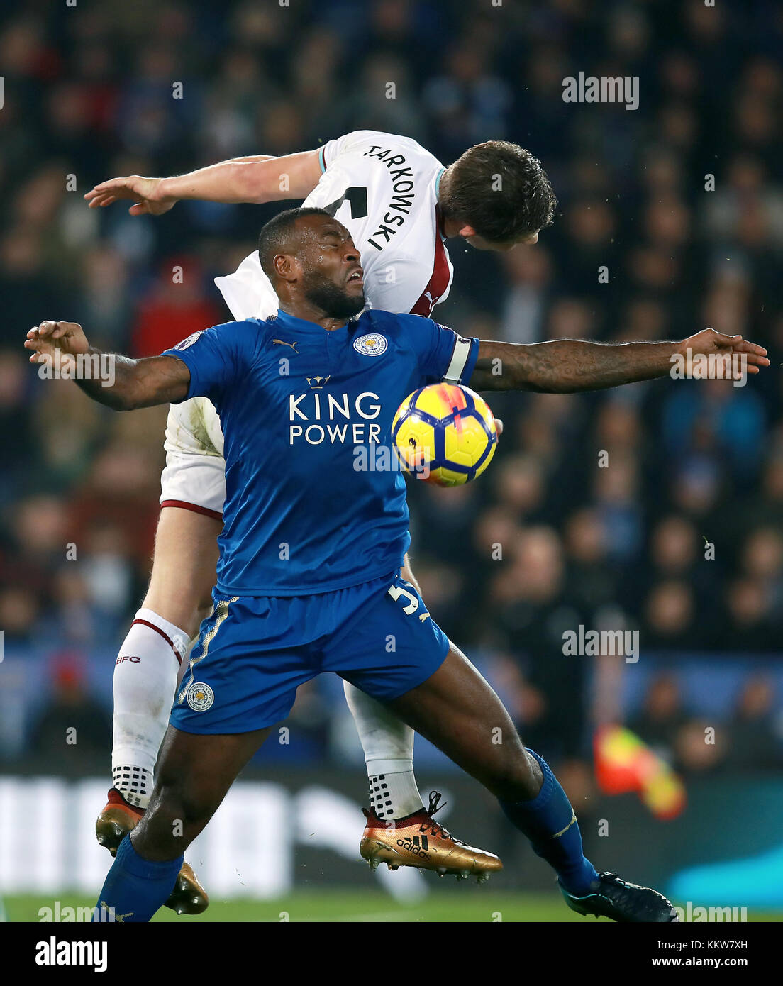 Leicester City's Wes Morgan (front) and Burnley's James Tarkowski battle for a header during the Premier League match at the King Power Stadium, Leicester. PRESS ASSOCIATION Photo Picture date: Saturday December 2, 2017. See PA story SOCCER Leicester. Photo credit should read: Mike Egerton/PA Wire. RESTRICTIONS: No use with unauthorised audio, video, data, fixture lists, club/league logos or 'live' services. Online in-match use limited to 75 images, no video emulation. No use in betting, games or single club/league/player publications. Stock Photo