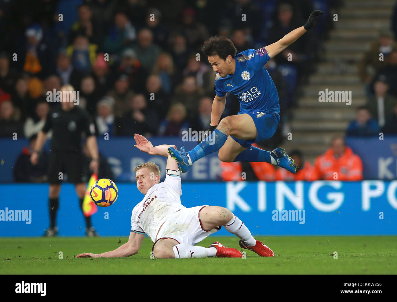 Leicester City's Shinji Okazaki (right) and Burnley's Ben Mee battle for the ball during the Premier League match at the King Power Stadium, Leicester. PRESS ASSOCIATION Photo Picture date: Saturday December 2, 2017. See PA story SOCCER Leicester. Photo credit should read: Mike Egerton/PA Wire. RESTRICTIONS: No use with unauthorised audio, video, data, fixture lists, club/league logos or 'live' services. Online in-match use limited to 75 images, no video emulation. No use in betting, games or single club/league/player publications. Stock Photo