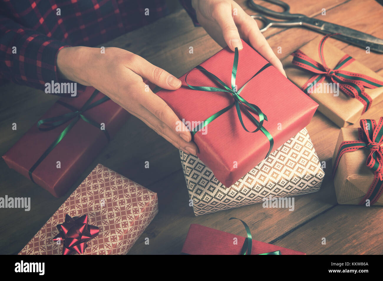 gift shop - woman holding packed present in hands Stock Photo