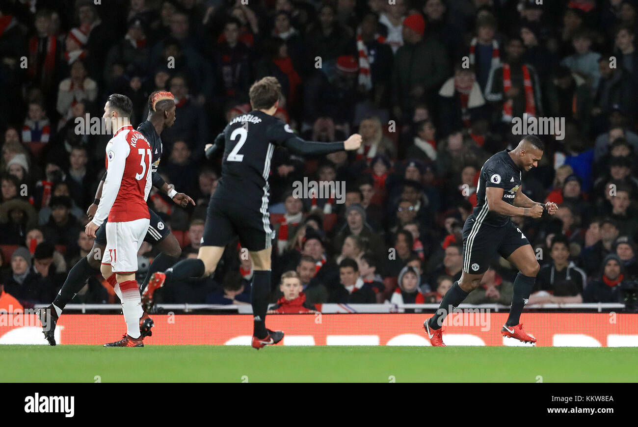 Manchester United's Antonio Valencia (right) celebrates scoring his side's first goal of the game during the Premier League match at the Emirates Stadium, London. PRESS ASSOCIATION Photo Picture date: Saturday December 2, 2017. See PA story SOCCER Arsenal. Photo credit should read: Adam Davy/PA Wire. RESTRICTIONS: EDITORIAL USE ONLY No use with unauthorised audio, video, data, fixture lists, club/league logos or 'live' services. Online in-match use limited to 75 images, no video emulation. No use in betting, games or single club/league/player publications. Stock Photo