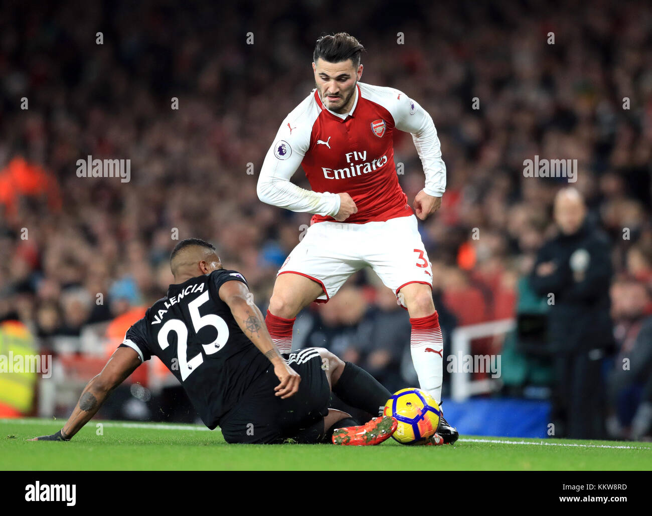 Manchester United's Antonio Valencia (left) and Arsenal's Sead Kolasinac battle for the ball during the Premier League match at the Emirates Stadium, London. PRESS ASSOCIATION Photo Picture date: Saturday December 2, 2017. See PA story SOCCER Arsenal. Photo credit should read: Adam Davy/PA Wire. RESTRICTIONS: EDITORIAL USE ONLY No use with unauthorised audio, video, data, fixture lists, club/league logos or 'live' services. Online in-match use limited to 75 images, no video emulation. No use in betting, games or single club/league/player publications. Stock Photo