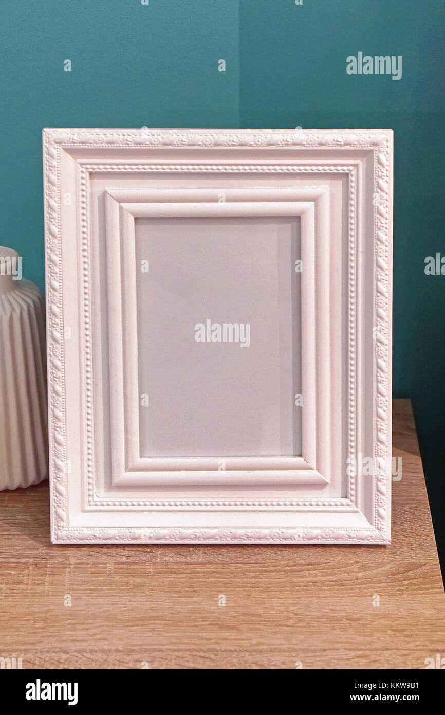 White portrait picture frame at table Stock Photo - Alamy