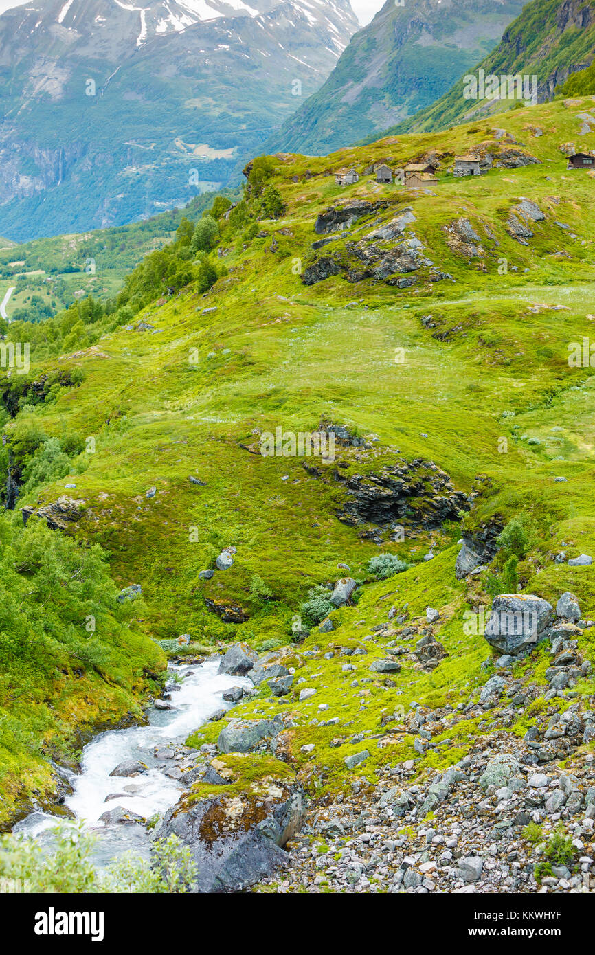 Stream River And Old Country Houses Cabins In The Mountains Stock