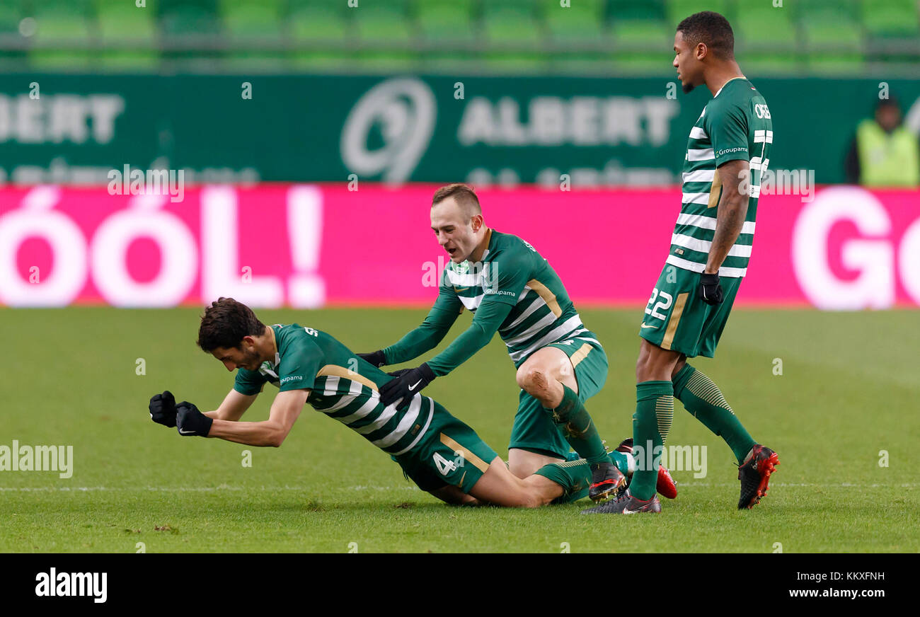 Kenneth Otigba of Ferencvarosi TC tackles Marko Futacs of MOL