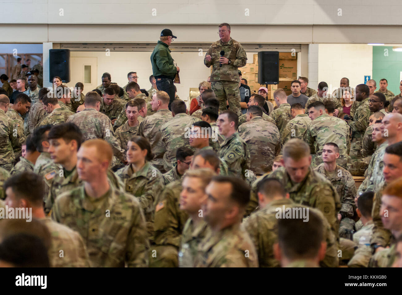 Fort Bragg, NC, USA. 1st Dec, 2017. Dec. 1, 2017 - FORT BRAGG, N.C., USA - Maj. Gen. Darrell Guthrie, standing right, U.S. Army Civil Affairs & Psychological Operations Command (Airborne), commanding general, calls out a number for a jump slot at Green Ramp on Pope Army Airfield, Friday, before the sun rises, waiting to donate their toys at the 20th Annual Randy Oler Memorial Operation Toy Drop. The airborne operation, hosted by USCAPOC (A), is the world's largest combined airborne operation with paratroopers from nine allied nations participating. The annual event allows paratr Stock Photo