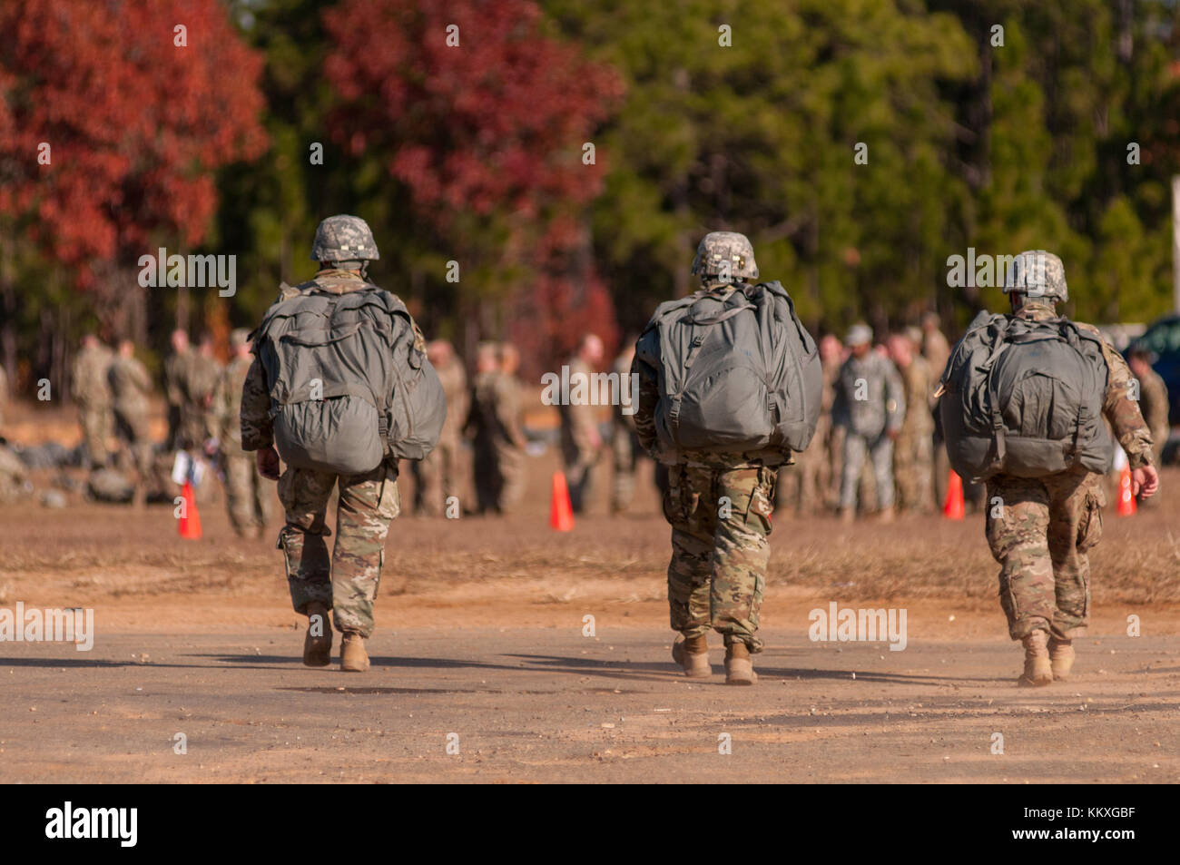 Fort Bragg, NC, USA. 1st Dec, 2017. Dec. 1, 2017 - FORT BRAGG, N.C., USA - U.S. Army paratroopers walk to the parachute turn-in point at Sicily Drop Zone, Friday, after successfully completing a jump during the 20th Annual Randy Oler Memorial Operation Toy Drop. The airborne operation, hosted by the U.S. Army Civil Affairs & Psychological Operations Command (Airborne), is the world's largest combined airborne operation with paratroopers from nine allied nations participating. The annual event allows paratroopers the opportunity to help children in communities surrounding Fort Br Stock Photo