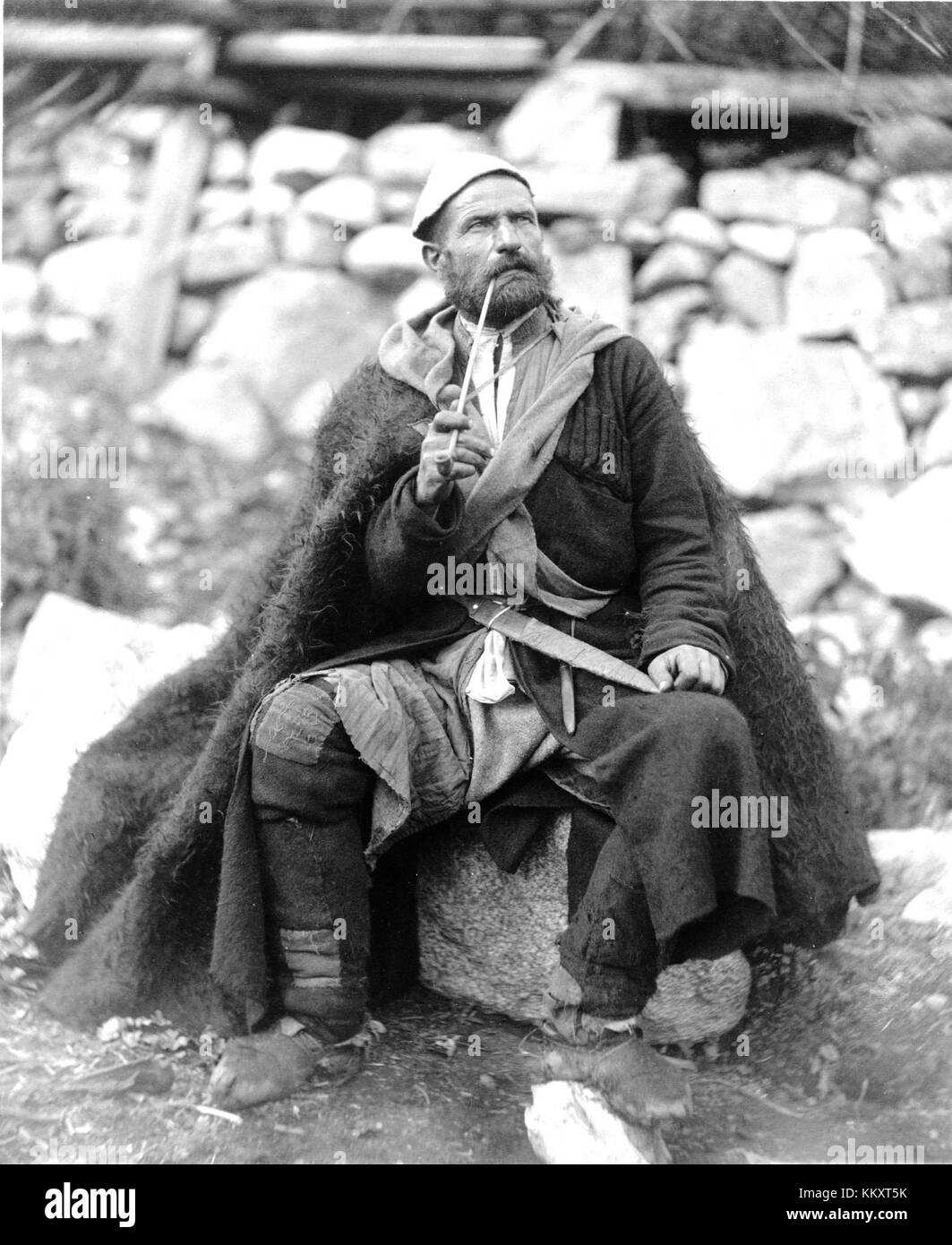 Old peasant with dagger and long smoking pipe, Mestia, Svanetia, Georgia (Republic) Stock Photo