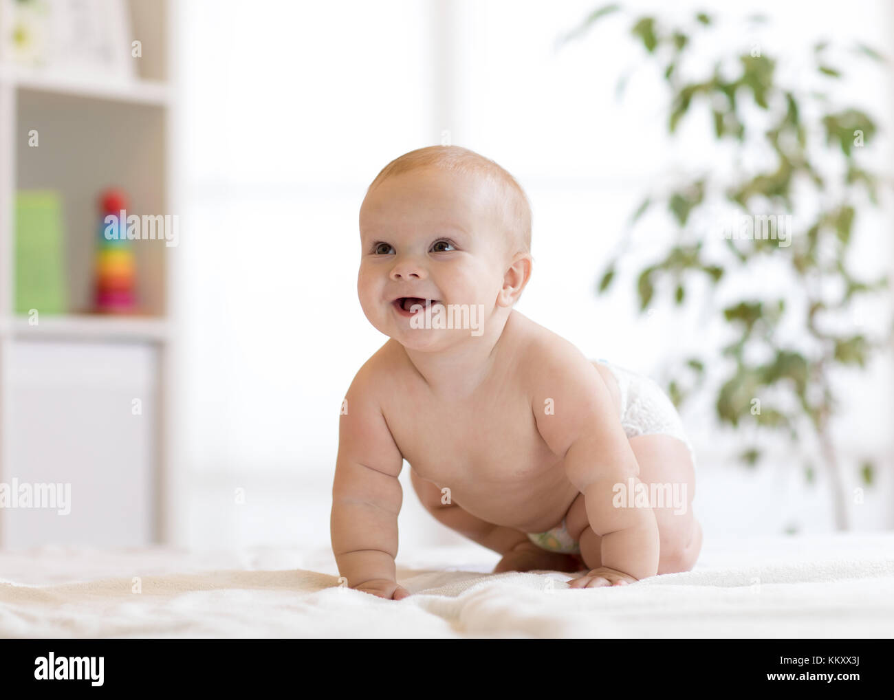 crawling funny baby boy at home Stock Photo