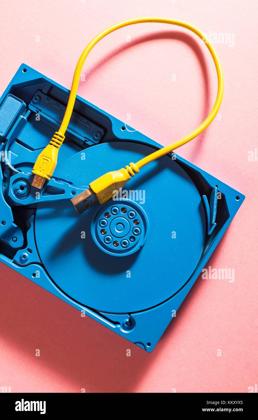 Blue colour hard disc and yellow USB cable Stock Photo - Alamy