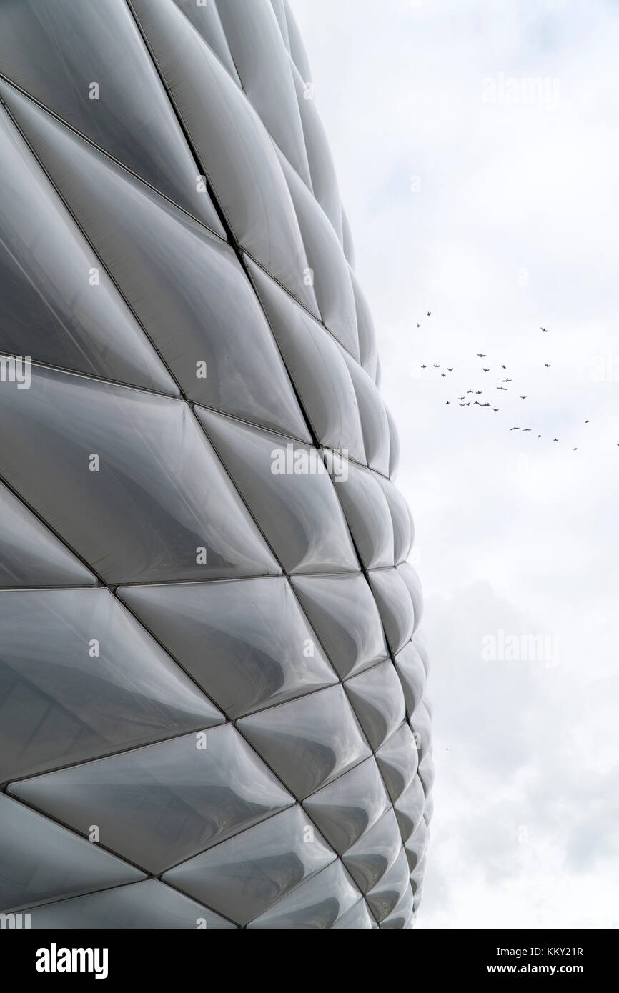 outside skin of the stadium in Munich with a flock of birds Stock Photo