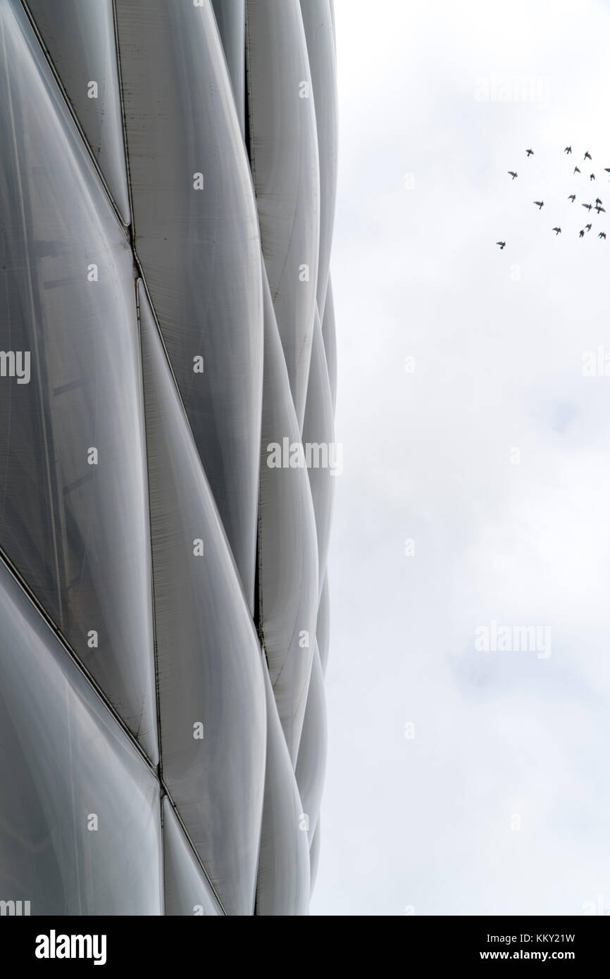 Air cushion wall of the stadium in Munich with a flock of birds Stock Photo