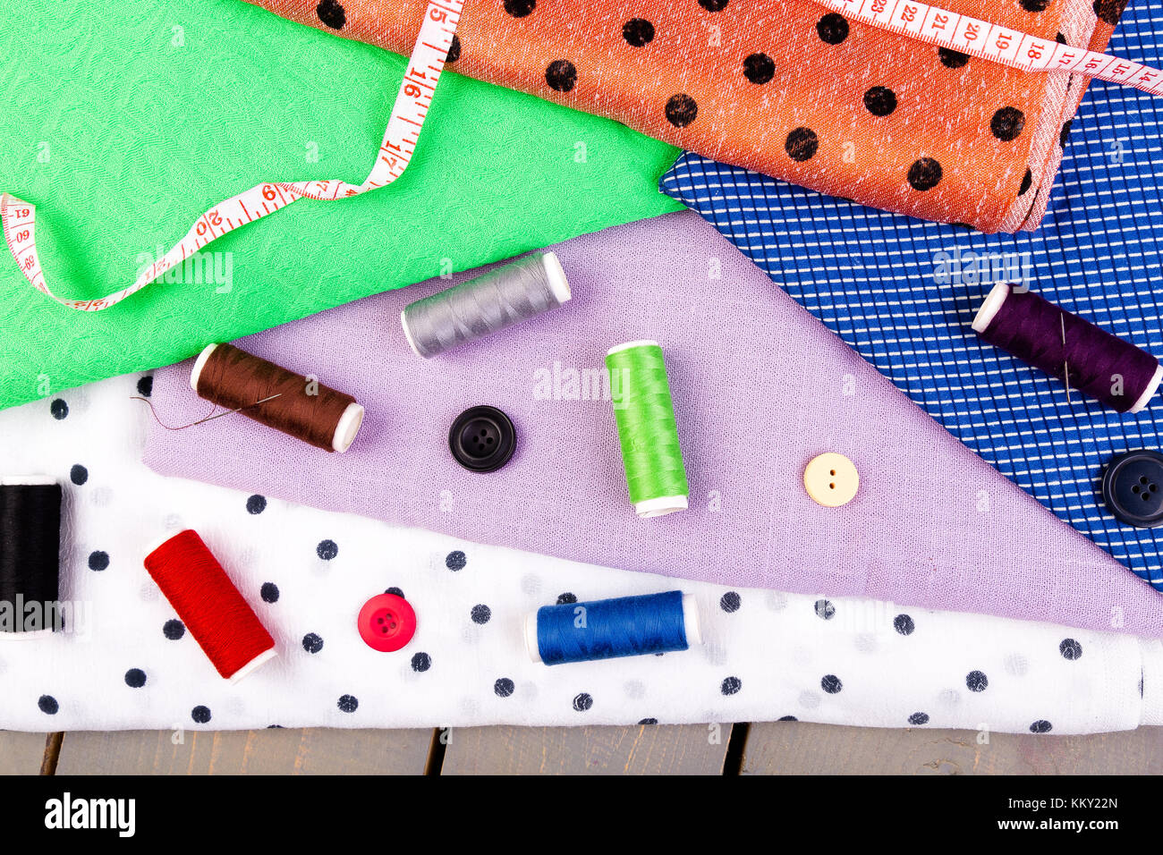 Items for sewing clothes. Sewing buttons, spools of thread and cloth