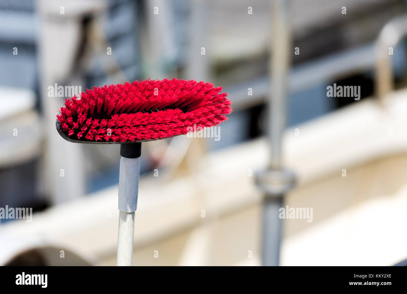 Red scrubber on a boat Stock Photo