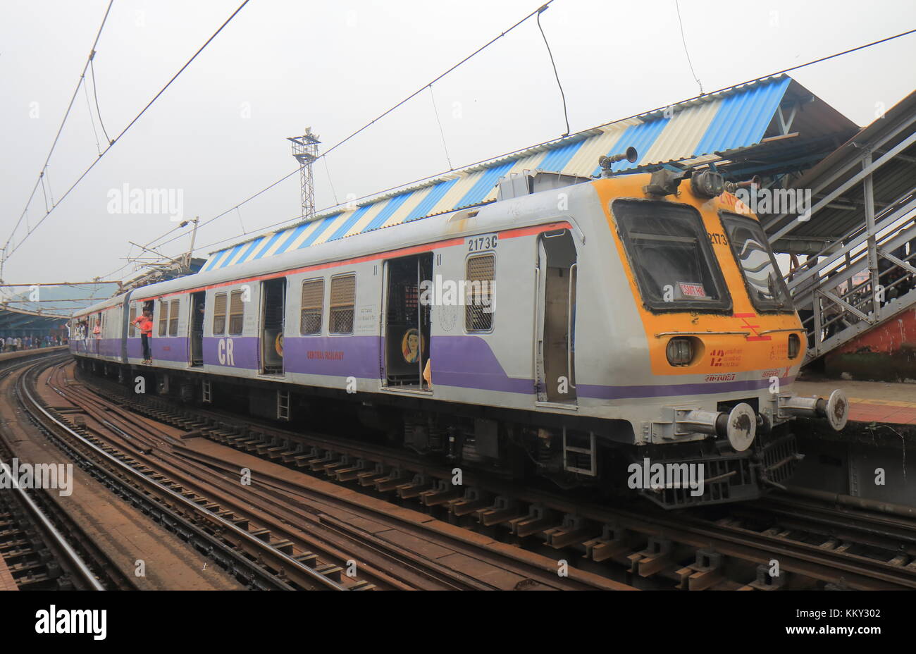 People travel by City train in downtown Mumbai India. Stock Photo