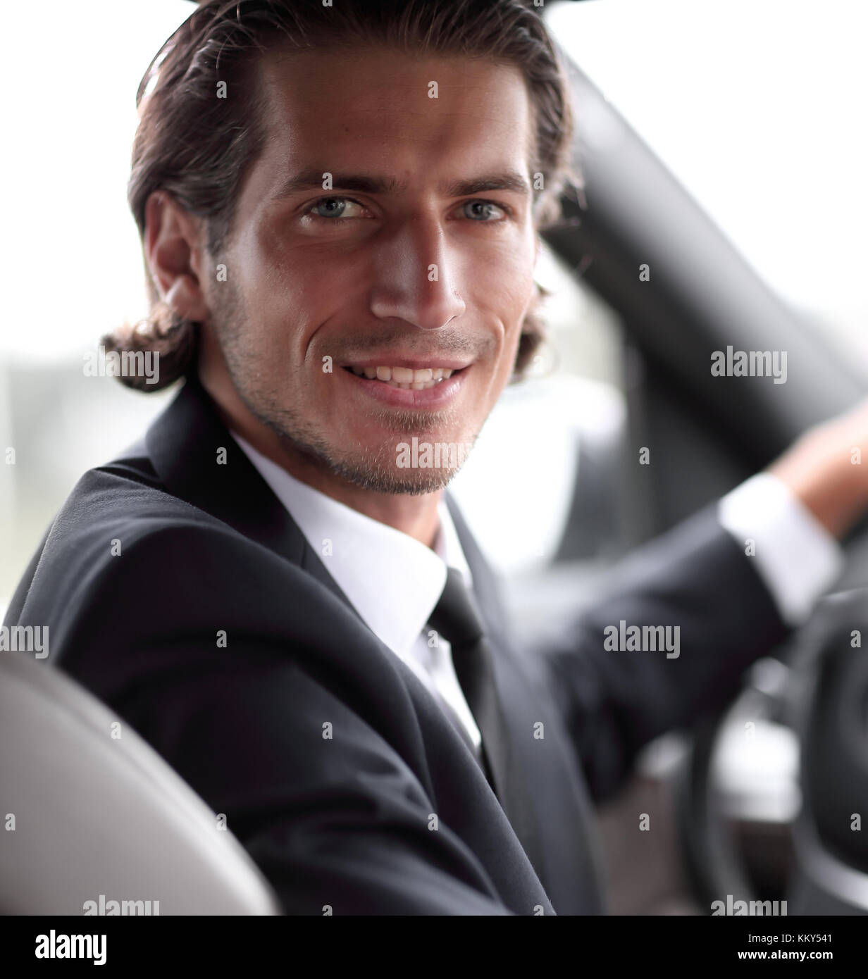 man sitting behind the wheel of a car Stock Photo - Alamy