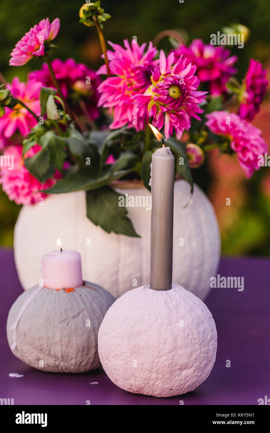 Table decoration, pumpkins, vase, flowers, candles, Stock Photo
