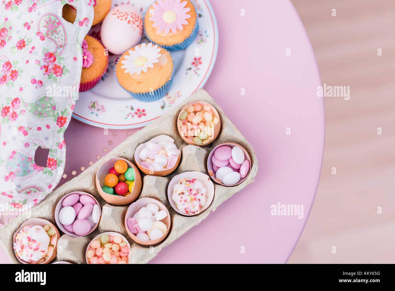 Eggshells filled with sweets, still life Stock Photo