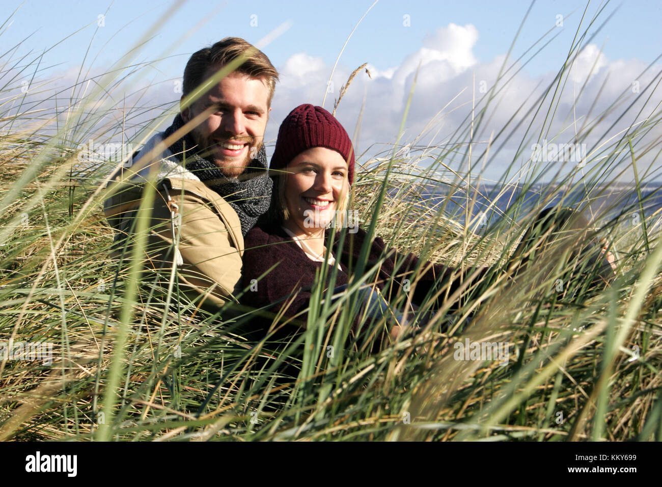 Couple, Baltic Sea, dunes, sit, smile, Stock Photo
