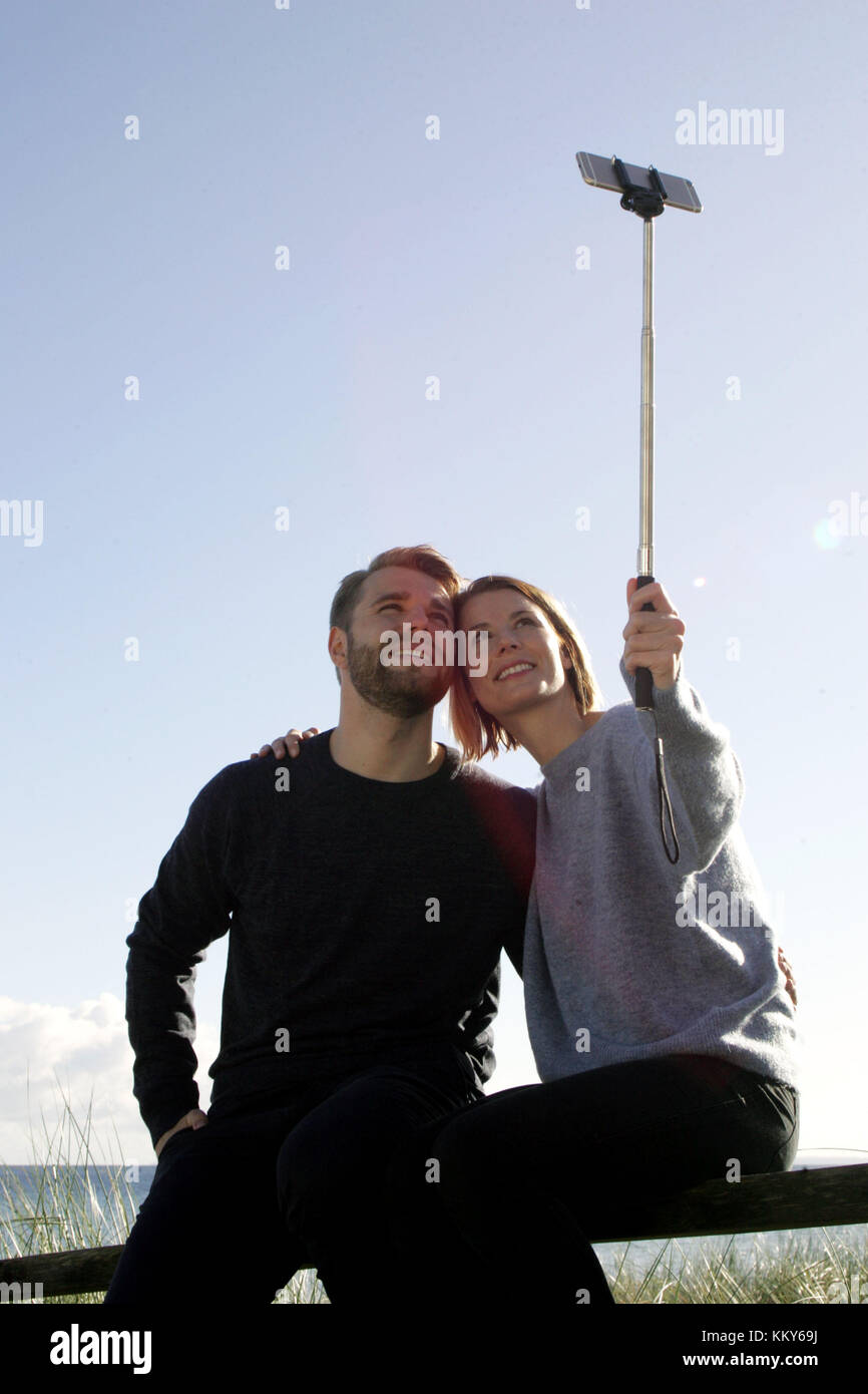 Couple, Baltic Sea, walk, handrail, sit, Selfie, Stock Photo