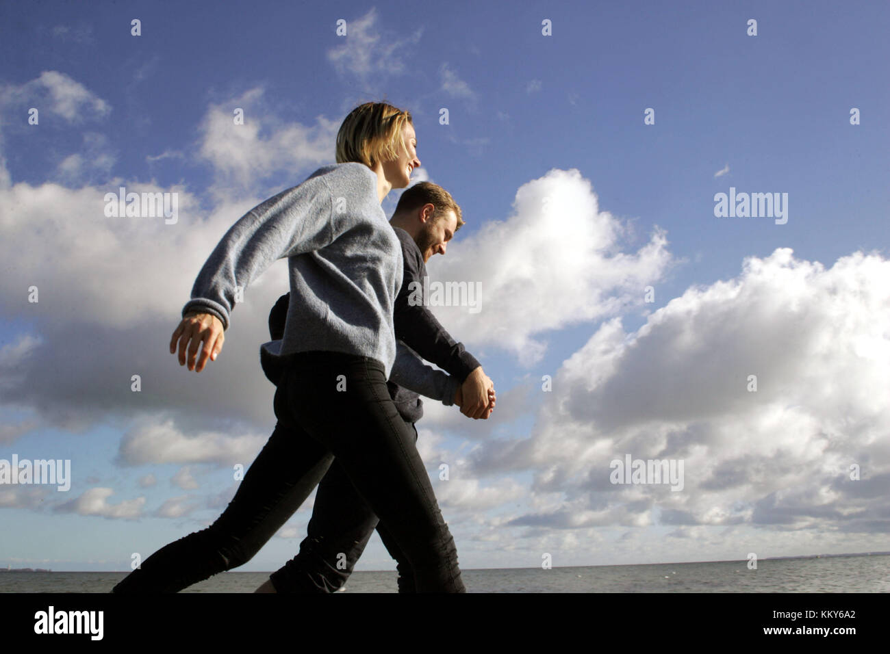 Couple, Baltic Sea beach, walk hand in hand, Stock Photo