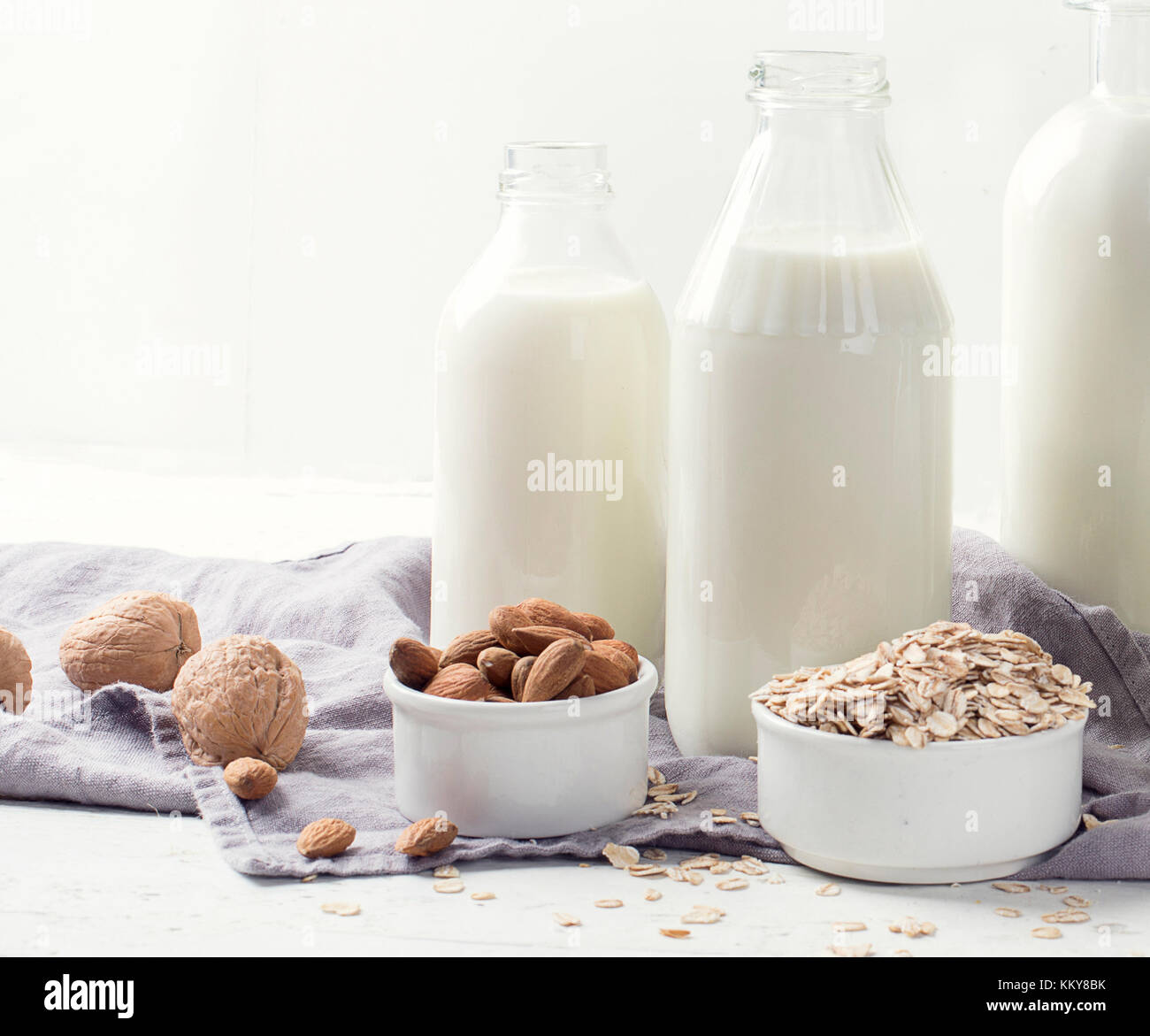 Alternative types of milks in glass bottles. Vegan non dairy milk Stock