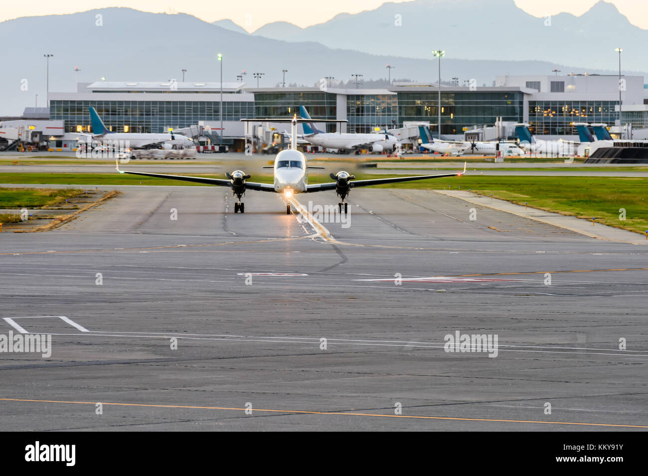 A beautiful landing of an airplane on the runway in a modern airport ...