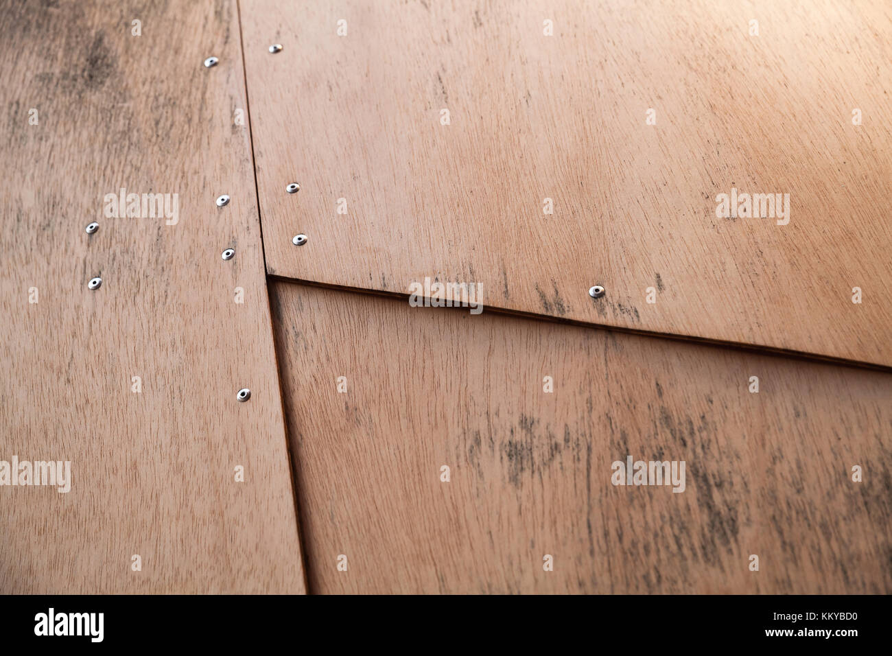 Structure made of plywood sheets connected with rivets, background