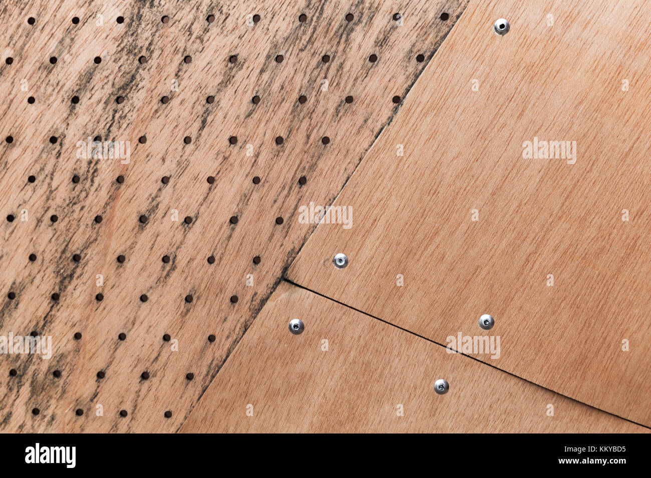Structure made of plywood sheets and rivets, background photo texture